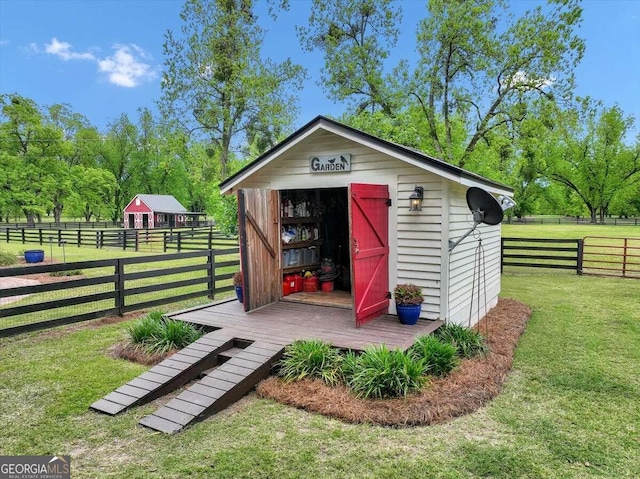 view of shed featuring fence