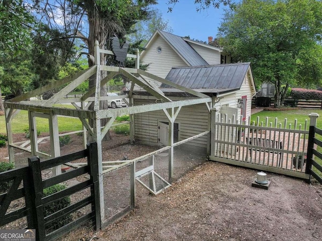 exterior space with an outbuilding and fence