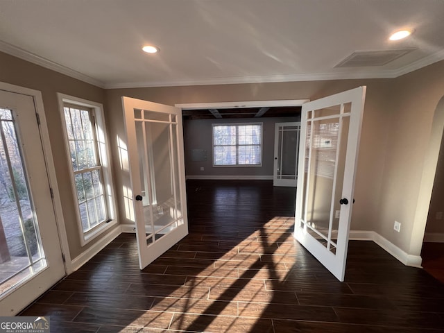 interior space featuring french doors, crown molding, and dark wood-type flooring