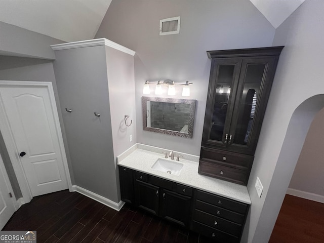 bathroom featuring vanity and vaulted ceiling