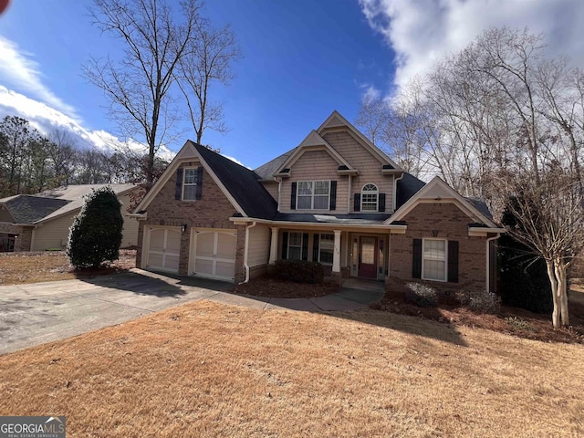 view of front of home featuring a porch and a garage