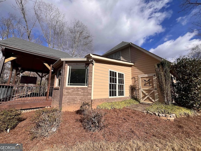 view of home's exterior featuring a deck