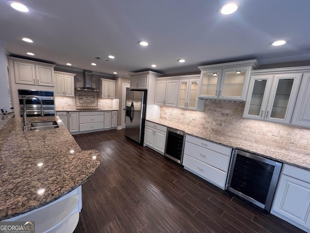 kitchen featuring stainless steel fridge with ice dispenser, white cabinetry, beverage cooler, and sink