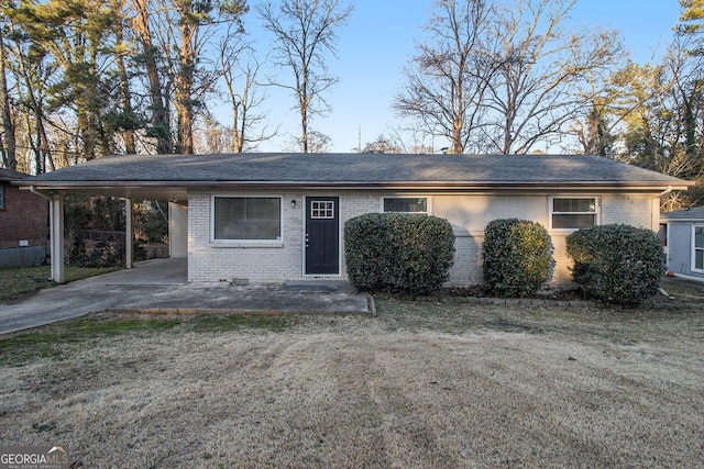 ranch-style home with a carport