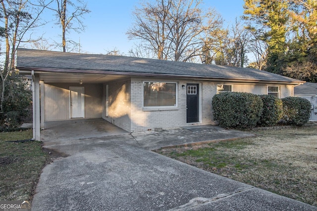 ranch-style house featuring a carport