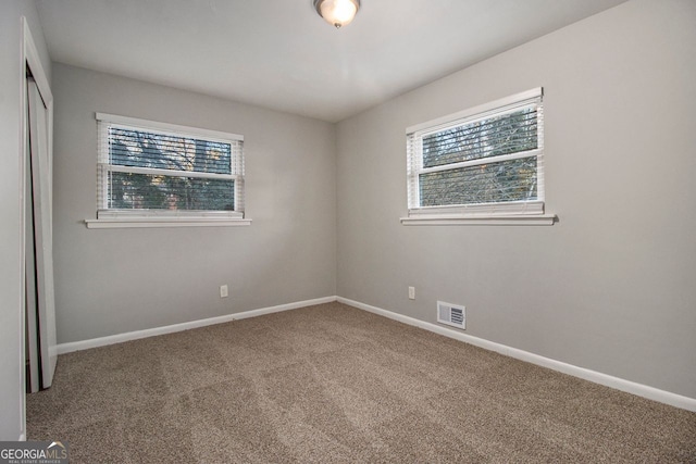 unfurnished room with carpet