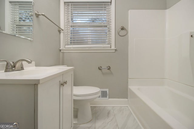 full bathroom featuring vanity, bathtub / shower combination, and toilet