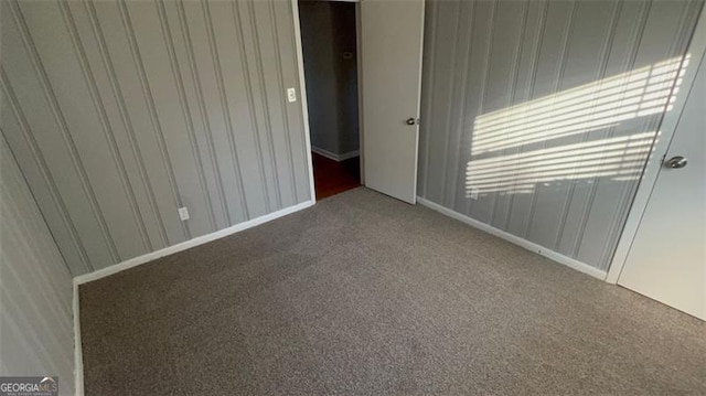 empty room with carpet flooring