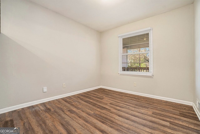 empty room featuring dark hardwood / wood-style floors