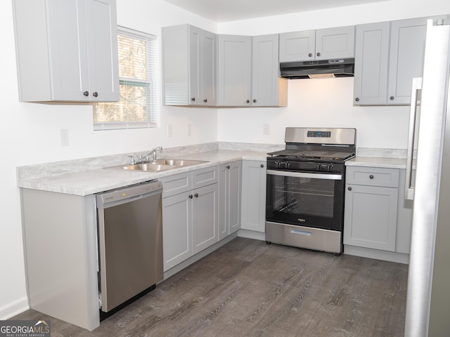 kitchen featuring gray cabinets, sink, and appliances with stainless steel finishes