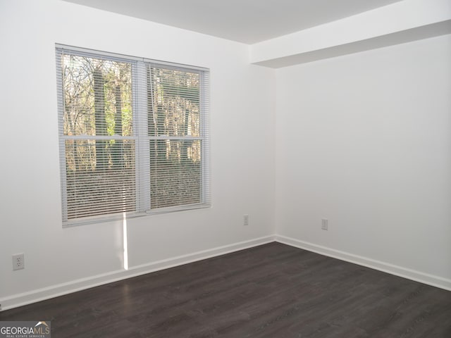 empty room featuring dark hardwood / wood-style floors