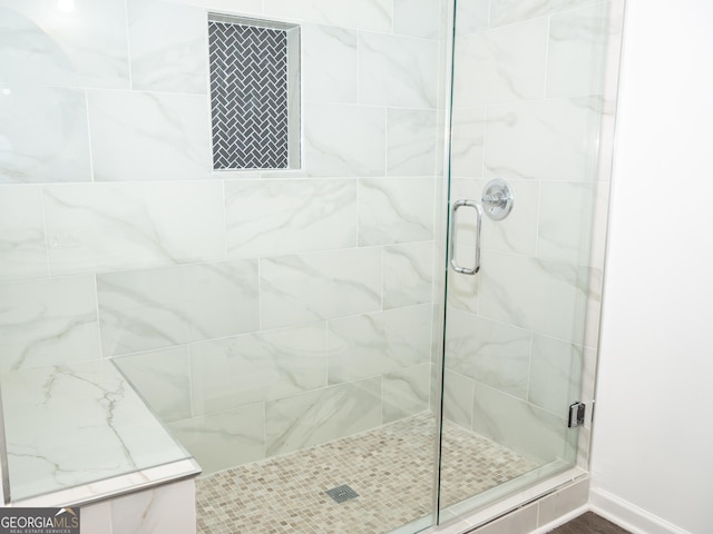 bathroom with an enclosed shower