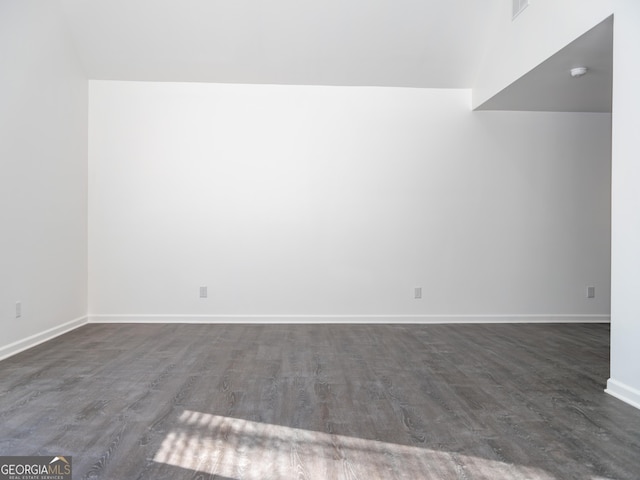 unfurnished room with dark hardwood / wood-style floors