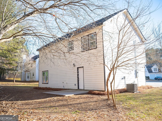 back of house with a patio and central AC unit