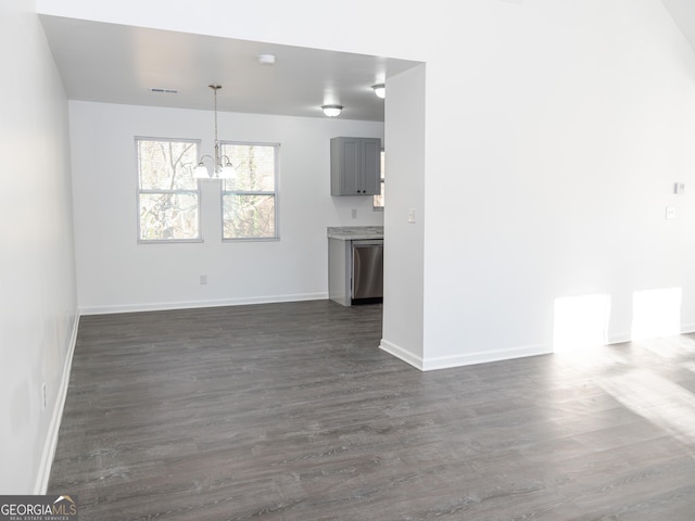 unfurnished living room with dark wood-type flooring