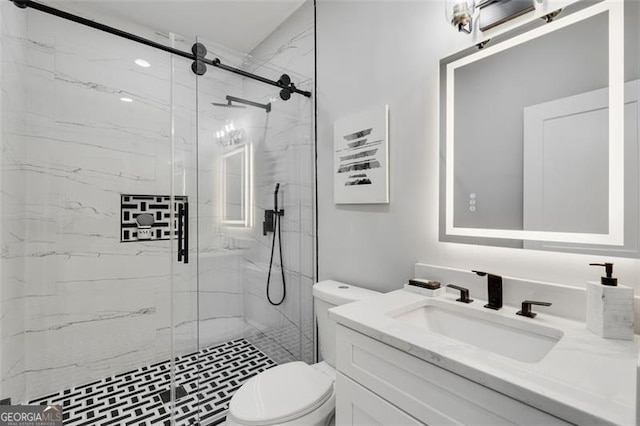 bathroom featuring vanity, toilet, and walk in shower