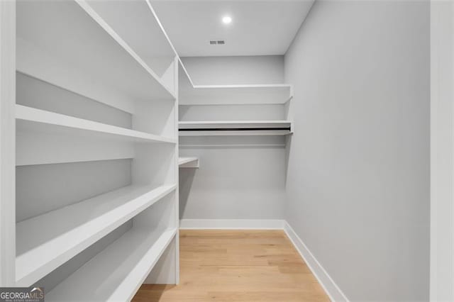 walk in closet featuring wood-type flooring