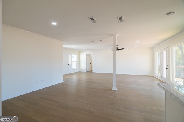 spare room featuring ceiling fan, ornamental molding, and hardwood / wood-style flooring