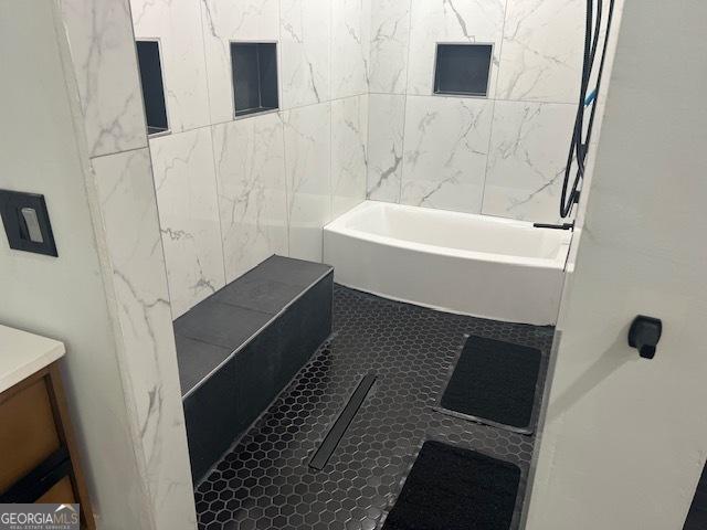 bathroom with tile patterned flooring and vanity