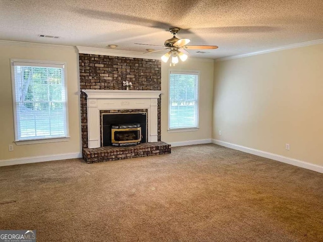 unfurnished living room featuring carpet, a textured ceiling, and ornamental molding