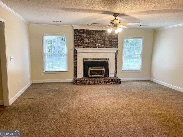 unfurnished living room featuring a textured ceiling, a wealth of natural light, and crown molding