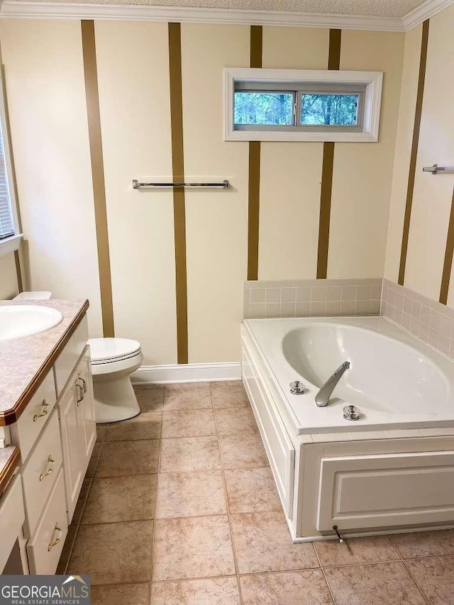 bathroom featuring a washtub, toilet, ornamental molding, and vanity