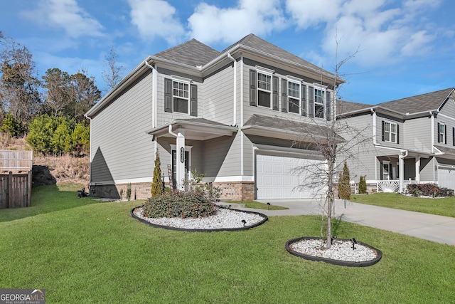 view of front of house with a garage and a front lawn