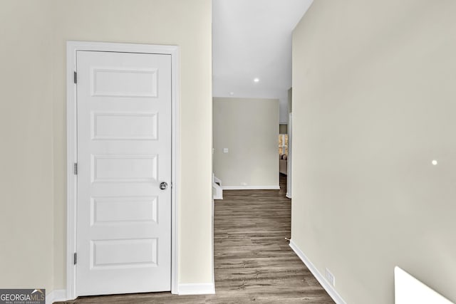 hall with hardwood / wood-style flooring