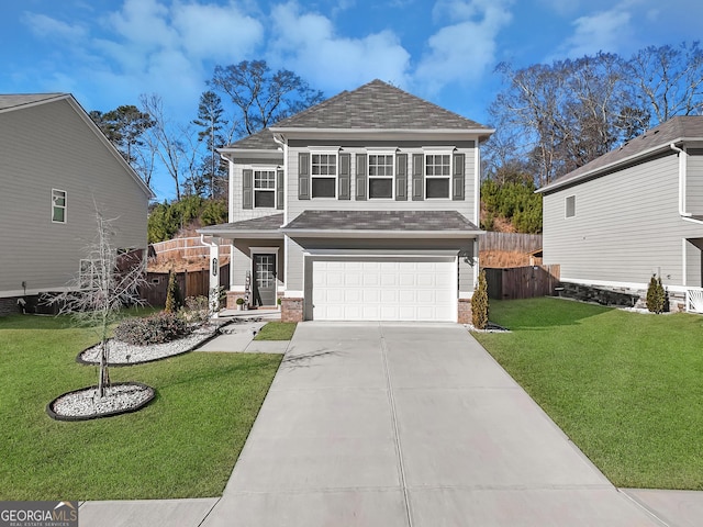 view of property featuring a front lawn and a garage