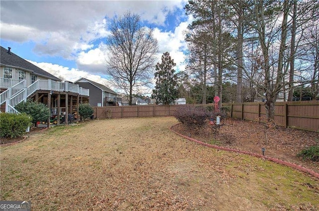 view of yard with a wooden deck