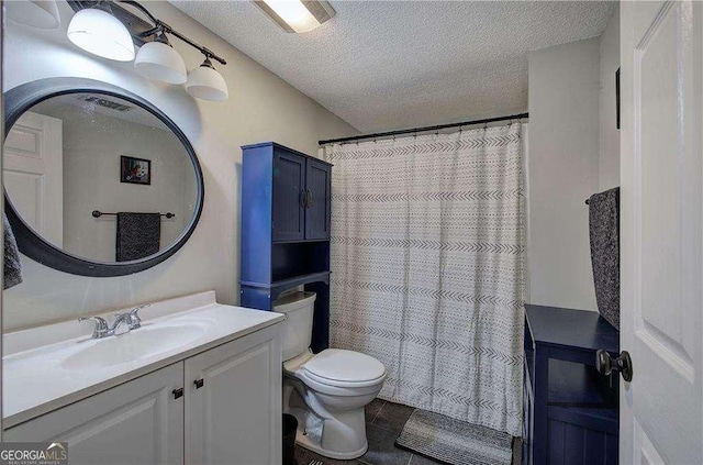 bathroom with a shower with curtain, vanity, toilet, and a textured ceiling