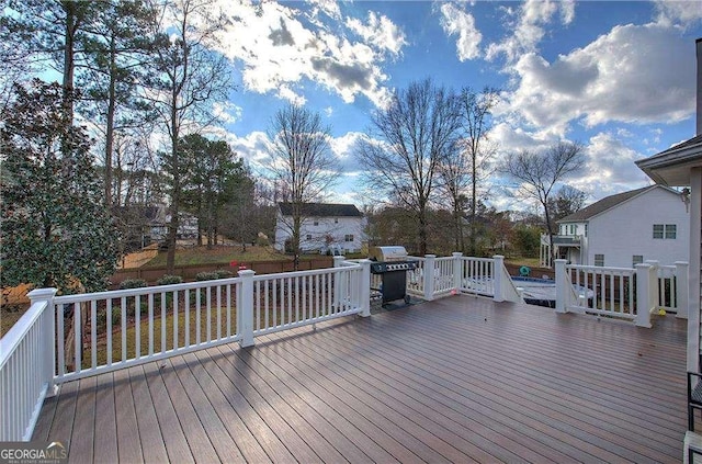 wooden terrace with area for grilling