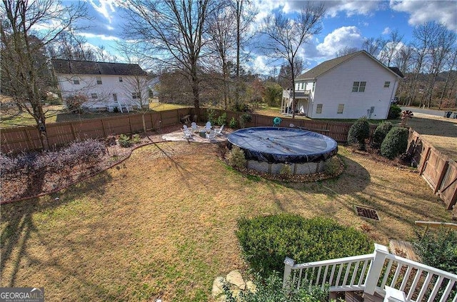 view of yard featuring a covered pool