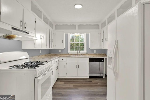 kitchen with dark hardwood / wood-style floors, white cabinetry, white appliances, and sink