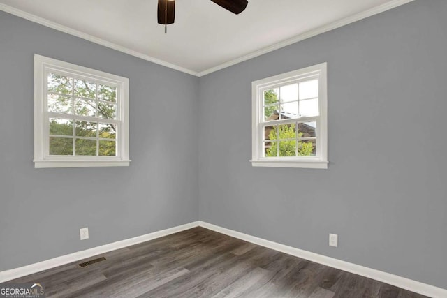 spare room featuring ceiling fan, dark hardwood / wood-style floors, and ornamental molding