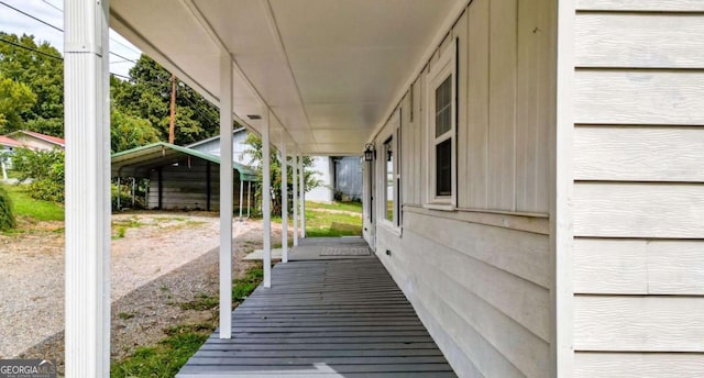 wooden terrace featuring a porch