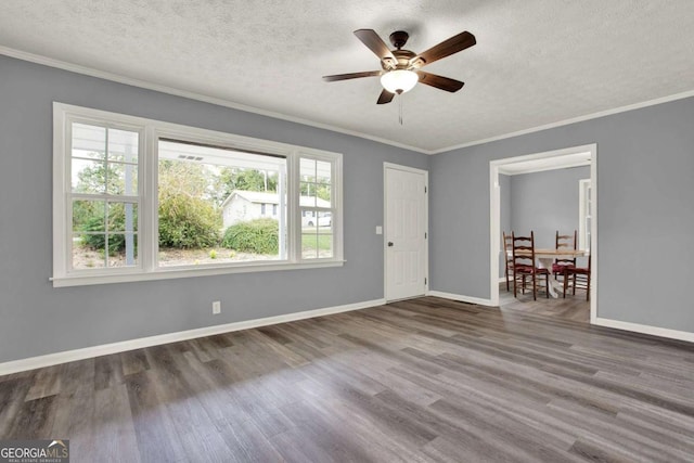 unfurnished room with hardwood / wood-style flooring, ceiling fan, a textured ceiling, and a wealth of natural light