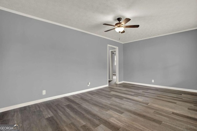 spare room featuring a textured ceiling, dark hardwood / wood-style floors, ceiling fan, and crown molding