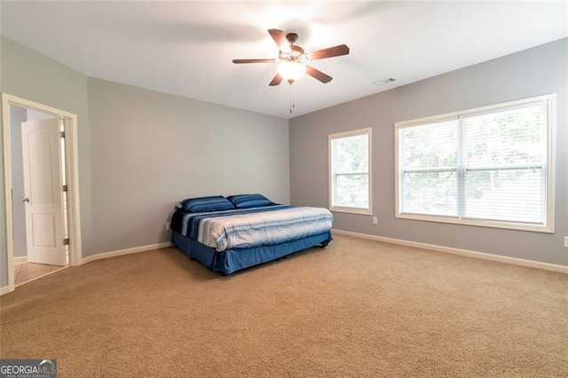 carpeted bedroom with ceiling fan