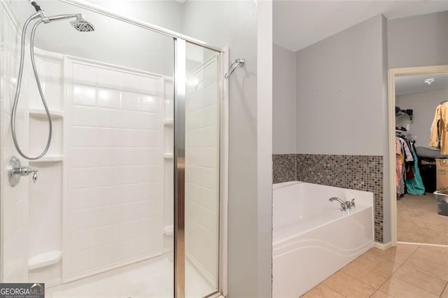 bathroom with tile patterned flooring and plus walk in shower