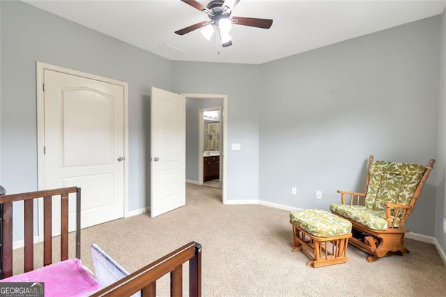 bedroom with ceiling fan and light carpet