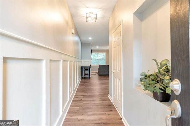 hallway with wood-type flooring