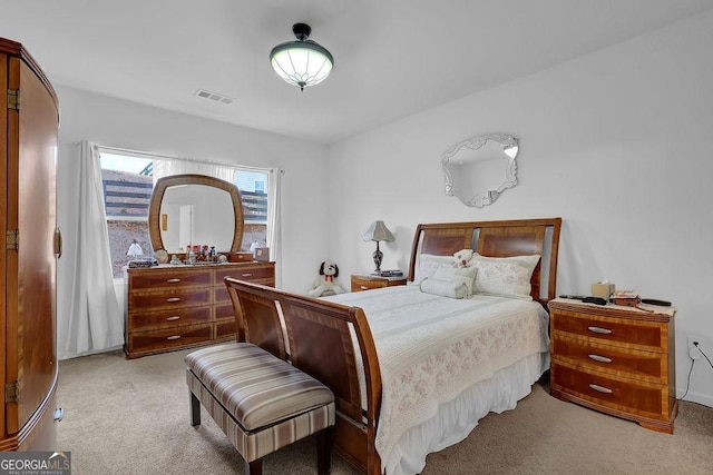 bedroom featuring light carpet