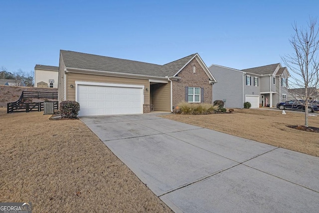 single story home with a front yard and a garage