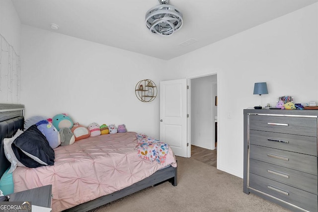 bedroom with light carpet