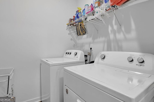 washroom with independent washer and dryer