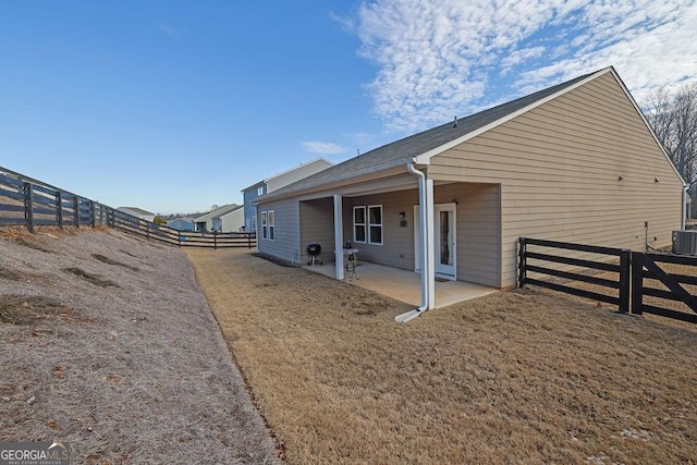 view of property exterior featuring central air condition unit and a patio area