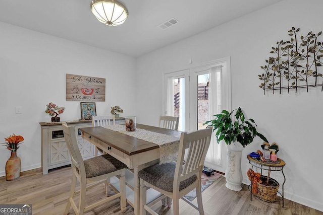 dining room featuring light hardwood / wood-style flooring