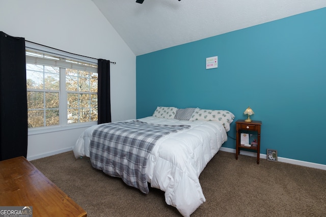 bedroom featuring dark colored carpet, ceiling fan, and vaulted ceiling