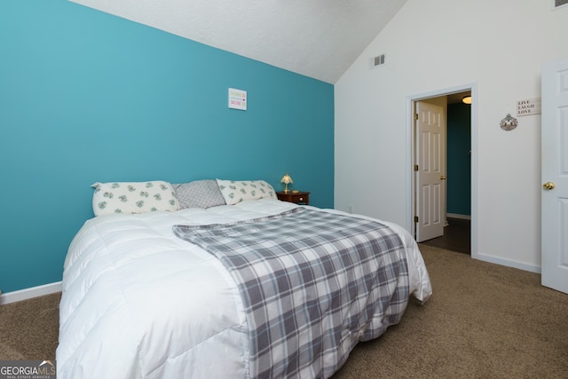 bedroom with carpet flooring and vaulted ceiling